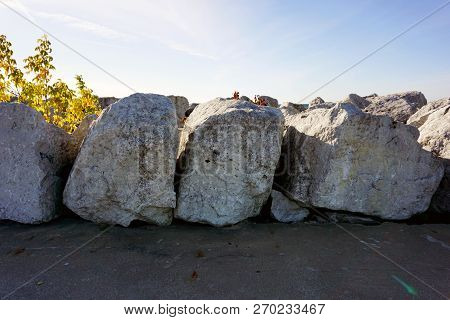 Large Boulders Serve As A Breakwall To Protect The Bay View Swimming Beach From The Effect Of Waves,