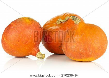 Group Of Three Whole Teardrop Shaped Fresh Red Kuri Pumpkin Hokkaido Variety Isolated On White Backg