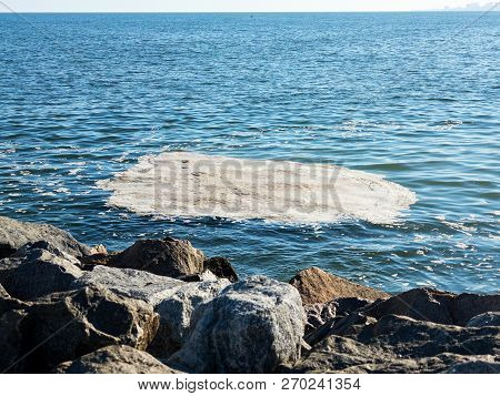 Full Frame Take Of Some Extremely Polluted Waters. Dirty Sea Water. Dirt On Water. Dirty Oil Spots O