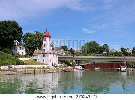 Kincardine, Ontario Lighthouse Reflects In Pristine Inlet Of Lake Huron