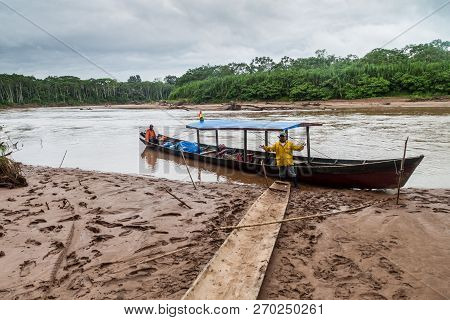 Madidi, Bolivia - May 7, 2105: Tour Guides In A Canoe On Beni River In Madidi National Park, Bolivia