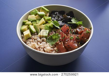 Tuna Poke With Avocado, Wild Rice And Seaweed. Hawaiian Traditional Food