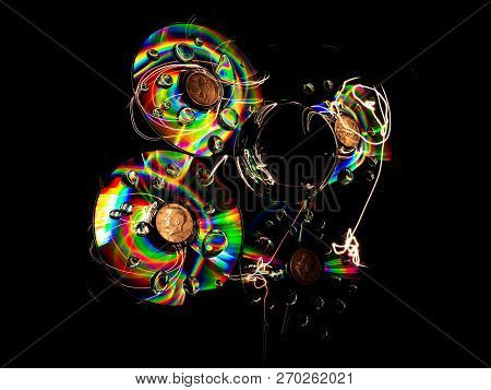 The Lensball And Discs Appear To Be In Vertical Suspension.