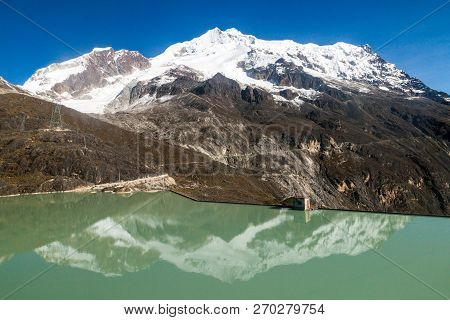 Zongo Dam, Located In Zongo Pass In The Altitude Of 4700m, Bolivia. Peak Of Huayna Potosi Mountain I