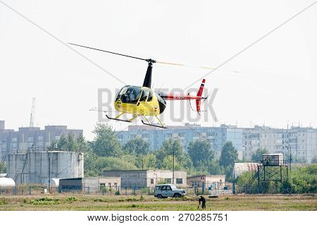 Tyumen, Russia - August 11, 2012: On A Visit At Utair Airshow In Heliport Plehanovo. Pilot Of Robins