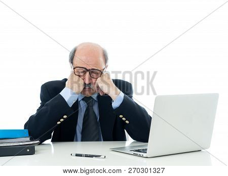 Overwhelmed And Tired Old Businessman Working With Laptop Feeling Angry At Office
