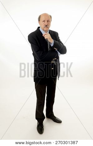 Full Body Portrait Of Serious Confident Senior Businessman Looking Smart