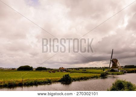 Photograph Of A Classic Vintage Windmill In Holland