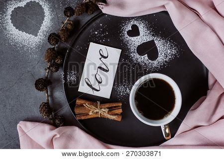 Valentines Day With Cup Of Coffee, Bumps,skarf, Cinnamon And Heart On Gray Table From Above In Flat 