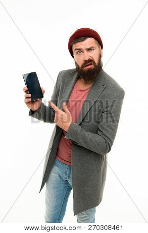 User Outraged. Man Brutal Bully Appearance Hold Smartphone Isolated White. Bearded Brutal Guy Pointi