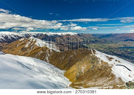 New Zealand mountain panorama and snow ski slopes as seen from Coronet Peak ski resort, Queenstown