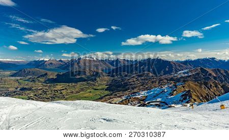 New Zealand mountain panorama and snow ski slopes as seen from Coronet Peak ski resort, Queenstown