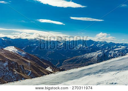 New Zealand mountain panorama and snow ski slopes as seen from Coronet Peak ski resort, Queenstown