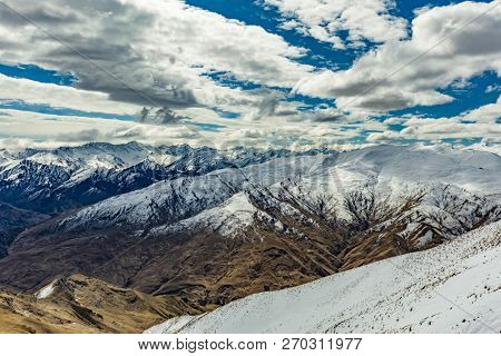 New Zealand mountain panorama and snow ski slopes as seen from Coronet Peak ski resort, Queenstown