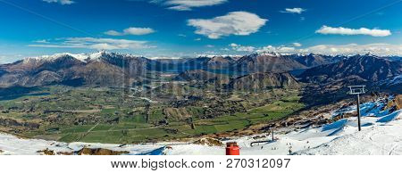 New Zealand mountain panorama and snow ski slopes as seen from Coronet Peak ski resort, Queenstown