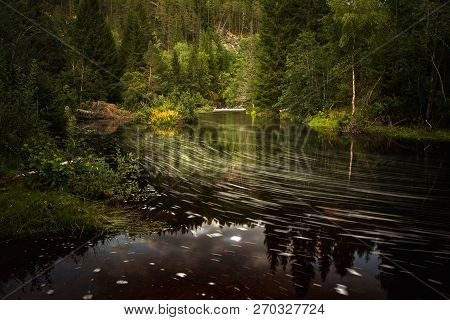 Long Exposure Time On Flowing River, Patterns On The Water Surface.