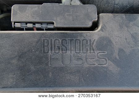Cover Of A Under Hood Fuse Box Of A Car. External Plus Terminal For Jumper Cables Next To The Fusebo