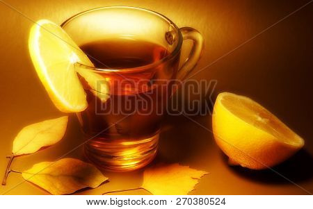 Drinking Tea With Lemon In A Glass Mug Brown Background Close-up