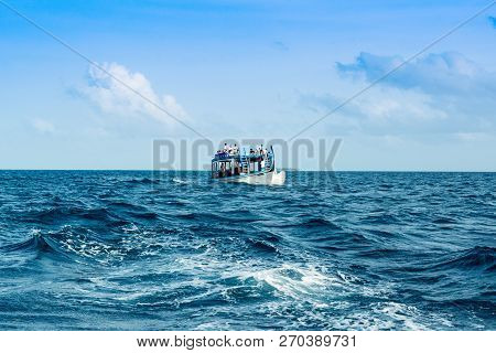 Lhaviyani Atoll, Maldives - 30 July 2018: Tourists On A Traditional Maldivian Wooden Boat Dhoni In T