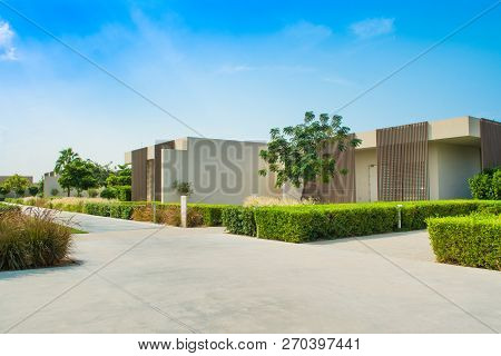 Ajman, United Arab Emirates - 30 October 2018: Landscape With Modern Design Villas And Garden In A L