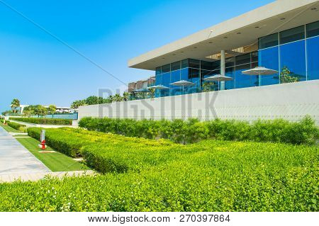 Ajman, United Arab Emirates - 30 October 2018: Landscape With Modern Design Restaurant Building And 