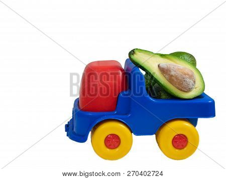 Big Toy Truck With Half Of Avocado Fruit