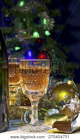Christmas Still Life With The Image Of A Bottle, Two Glasses Of Champagne, Chocolates, Christmas Dec