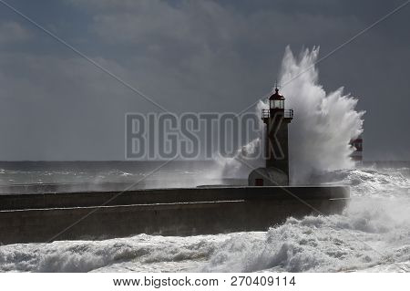 Big Storm With Big Waves Near A Lighthouse