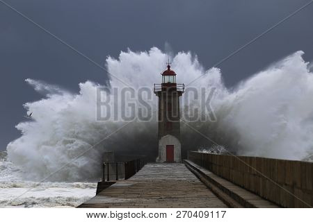 Big Storm With Big Waves Near A Lighthouse