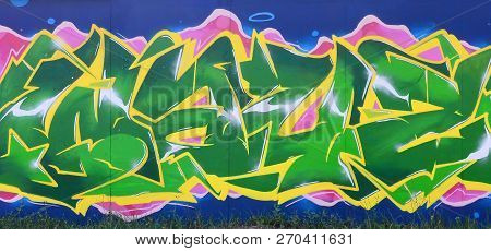 Full And Acomplished Graffiti Artwork. The Old Wall Decorated With Paint Stains In The Style Of Stre