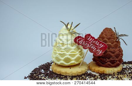 Fir-cone Form сakes, With Vanilla Sugar And Christmas Decoration, Isolated On A Light Background