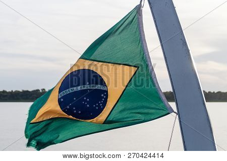Flag Of Brazil On A River Boat On Amazon River