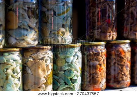 Pickled Honey Mushrooms In Jars At Village Marketplace.