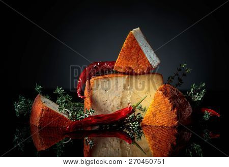 Red Pecorino Sheep Milk Cheese With Thyme And Red Pepper.