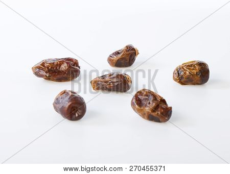 Dried Halawi Dates On A White