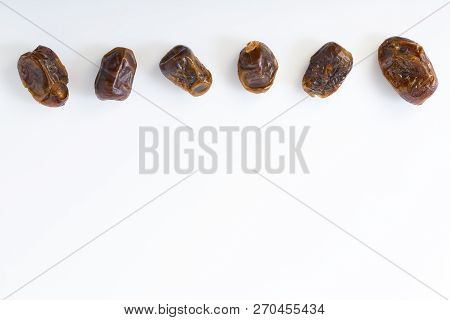 Dried Halawi Dates On A White