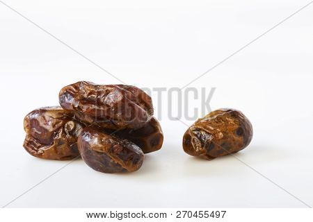 Dried Dates (fruits Of Date Palm Phoenix Dactylifera) On A White Background.