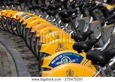 Brussels, Belgium - July 30, 2014: Yellow Bicycles Of Bicycle Self-service Villo For Rent In Histori