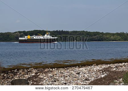 Small Ferry Passing An Island Near Faaborg, Denmark