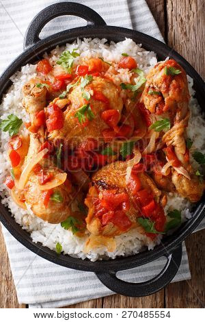 Haitian Chicken Recipe Is A One Pot Of Chicken, Tomatoes, Wine, Spices, And Rice Close-up. Vertical 