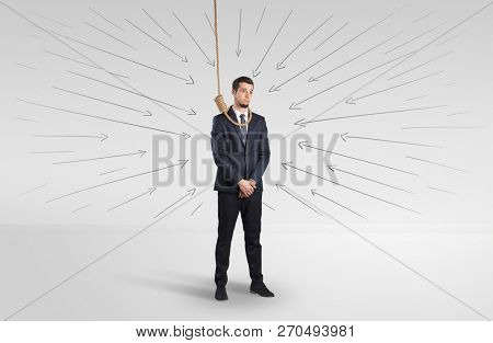 Hopeless young businessman trying to suicide with question signs concept