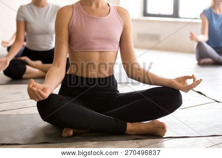 Yogi Woman And A Group Of People In Sukhasana Pose