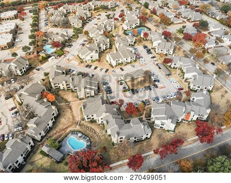 Aerial View Apartment Building With Swimming Pool And Colorful Fall Foliage