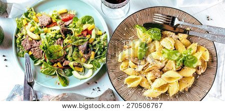 Fresh Salad Plate With Mixed Greens Arugula, Mesclun, Mache On Dark Wooden Background Close Up. Manz