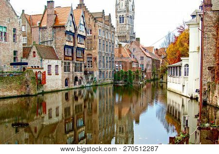 Brugge/belgium - Autumn. Old Town Buildings On The Canal. Beautiful Reflection