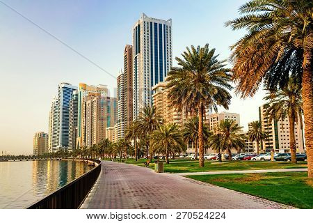 Morning Cityscape With Sun In Sharjah. Uae