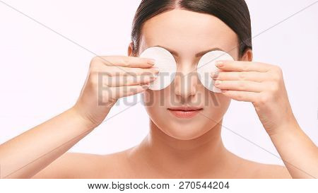 Young Girl Remove Cosmetic From Face. Skin Care With Cotton Pad