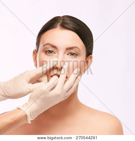 Plastic Medical Consultation. Doctor Hands. Woman Face