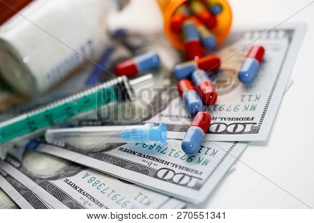 Money Dollars Used Syringe Pills And Unknown Powder Drug Trafficking Making Background. Law For The 