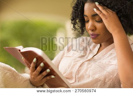African American Woman Studing And Reading The Bible.